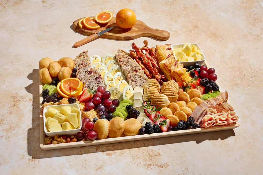 The Brunch Board with breakfast meats, pastries, eggs and fruit