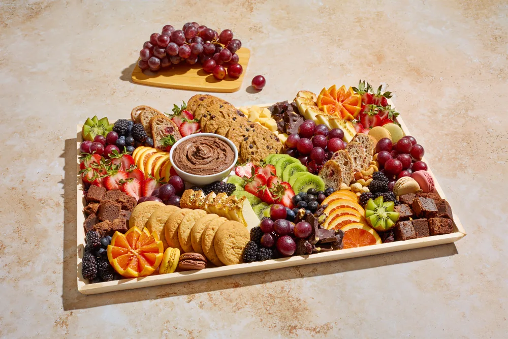The Sweet dessert board with chocolates and baked goods