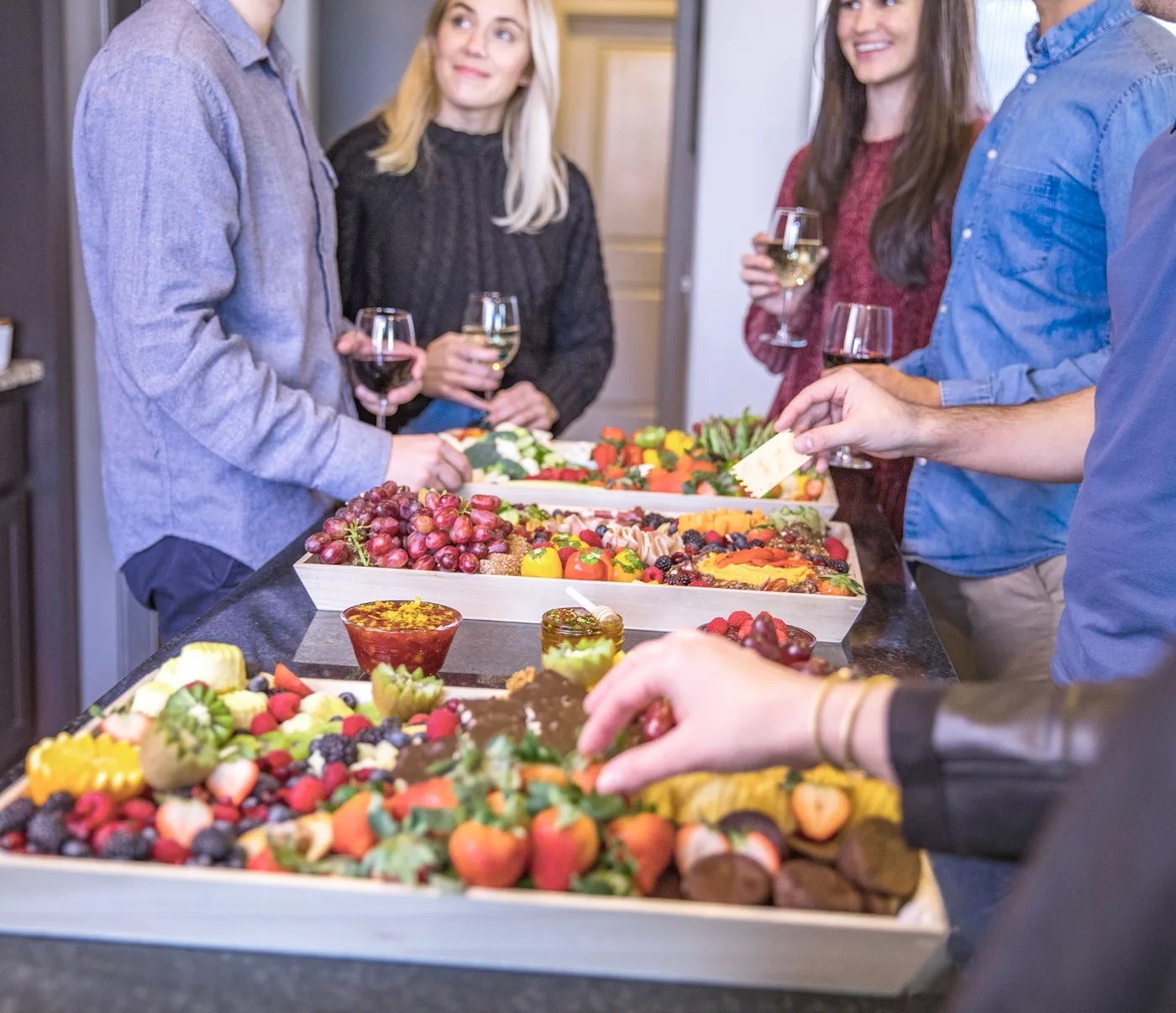 Cured meats, cheeses and fresh fruit arranged on a Graze Craze board